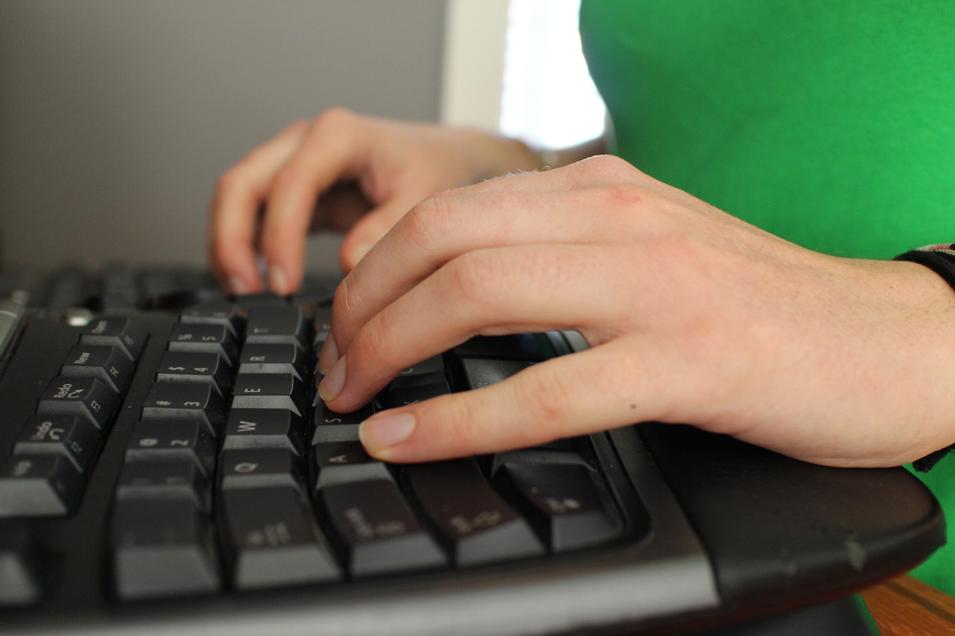 Yvonne McArthur typing at her keyboard
