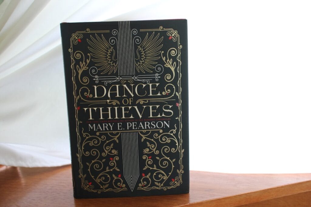A book cover showing a sword surrounded by stylized vines.